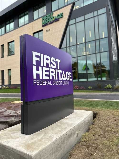 First Heritage Bank illuminated laser-cut metal sign in daylight